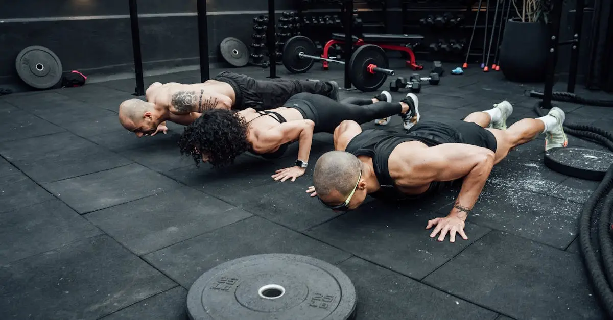 A group of diverse athletes of different ages and genders finishing a functional fitness race inside a large sports arena, celebrating at the finish line, wearing athletic gear and race numbers, realistic sports photography