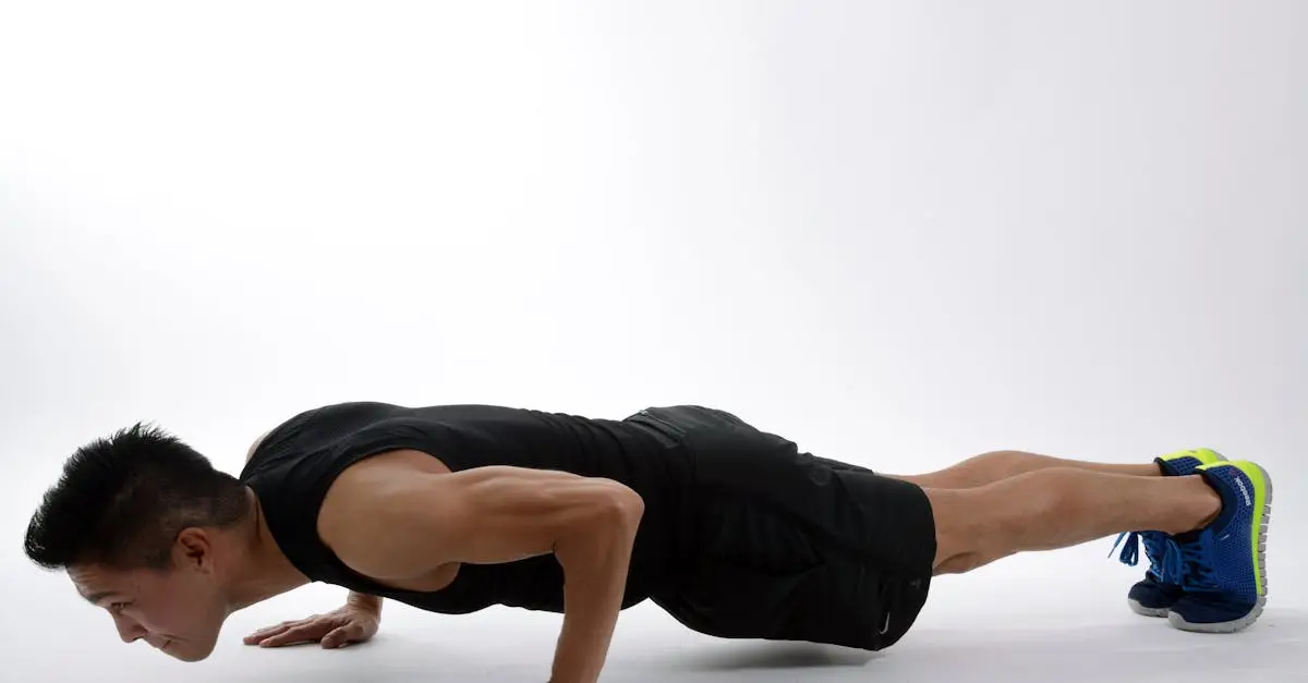 A male athlete pushing a heavy weighted sled across a rubber floor at a HYROX race event, low body position, maximum effort, sweat visible, sports hall with spectators, high contrast dramatic lighting, photorealistic