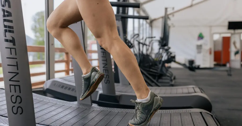 Close-up of a treadmill display showing speed and pace metrics, runner's feet visible on the belt, gym environment, sharp focus on the digital display, realistic fitness photography