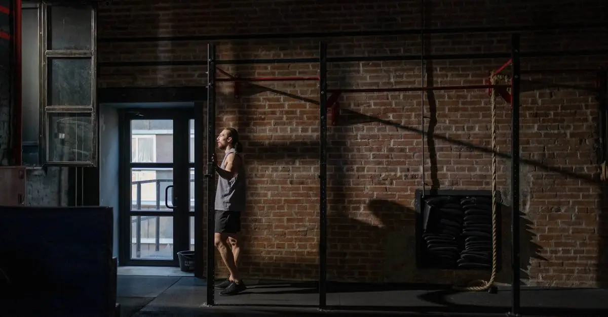 A male athlete throwing a wall ball against a marked target wall during a HYROX competition, deep squat position, focused expression, indoor sports arena with competition branding, realistic fitness photography