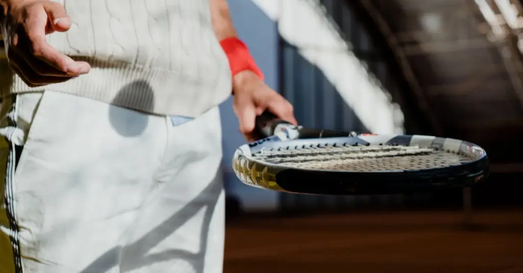 Close-up of a professional tennis player's shoes sliding on red clay court surface during a long rally, motion blur on the clay dust, intense match atmosphere, photorealistic sports photography